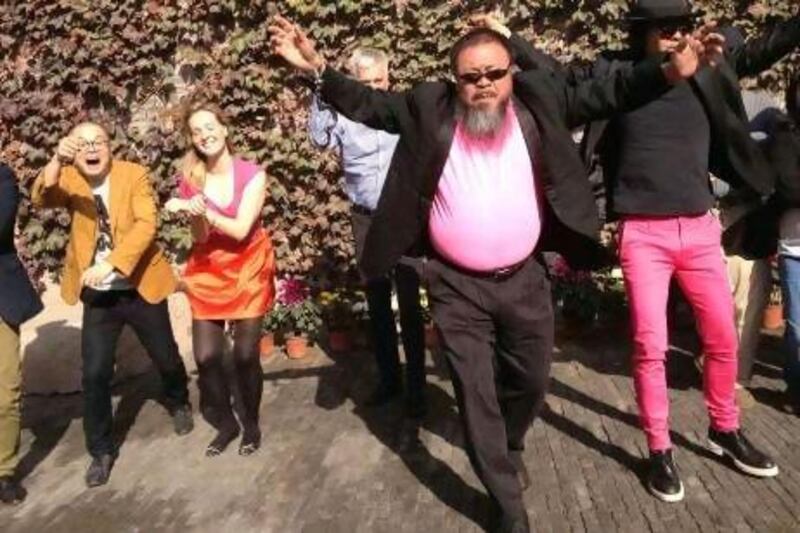 The dissident Chinese artist Ai Weiwei dances with his friends as they make a cover version of music video of Gangnam Style. Reuters