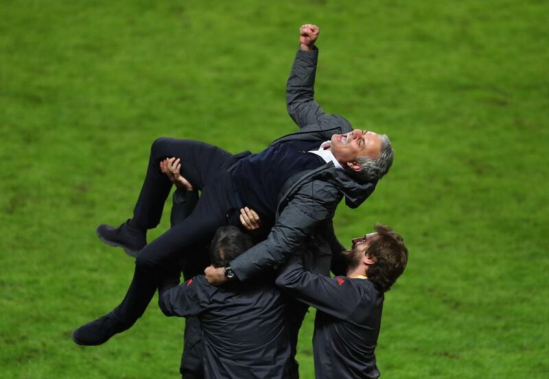 Manchester United manager Jose Mourinho celebrates winning the Europa League with his backroom staff at the Friends Arena in Stockholm, Sweden.  Alex Grimm / Getty Images