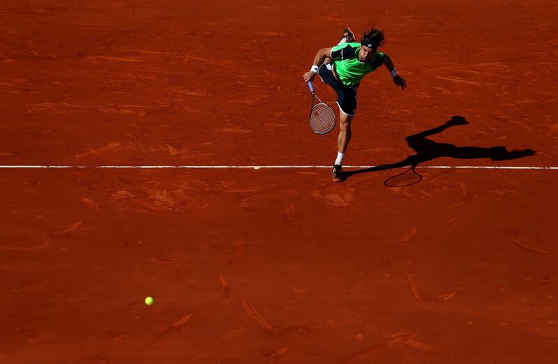 PARIS, FRANCE - JUNE 04:  David Ferrer of Spain plays a forehand in his Men's Singles quarter final match against Tommy Robredo of Spain during day ten of the French Open at Roland Garros on June 4, 2013 in Paris, France.  (Photo by Julian Finney/Getty Images) *** Local Caption ***  169915443.jpg
