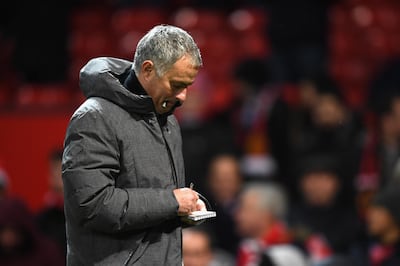MANCHESTER, ENGLAND - DECEMBER 10:  Jose Mourinho, Manager of Manchester United writes in his notepad during the Premier League match between Manchester United and Manchester City at Old Trafford on December 10, 2017 in Manchester, England.  (Photo by Michael Regan/Getty Images)