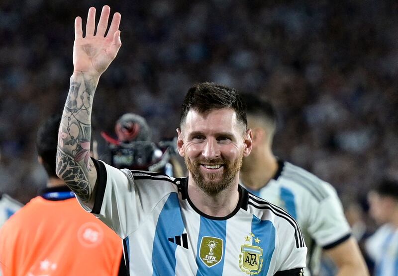 Argentina's forward Lionel Messi waves during a recognition ceremony for the World Cup winning team. AFP