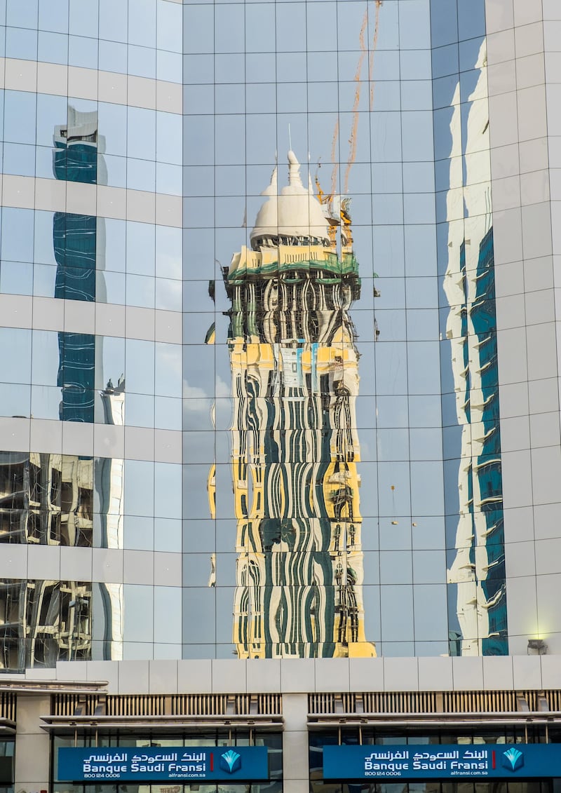 The exterior of Banque Saudi Fransi is shown with it's windows reflecting the Narcissus Hotel tower under construction in Riyadh, Saudi Arabia, April 23, 2016. Photographer: Waseem Obaidi for The National *** Local Caption ***  014Riyadh assignment_.jpg