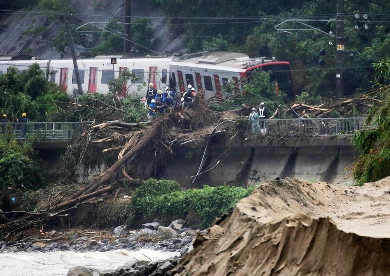 A JR railway train is derailed due to heavy rain in Karatsu, Saga Prefecture, southwestern Japan. EPA