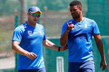 South Africa's head coach Mark Boucher, left, speaks with bowler Vernon Philander during a net session at the Supersport Park Cricket Stadium in Centurion. AFP