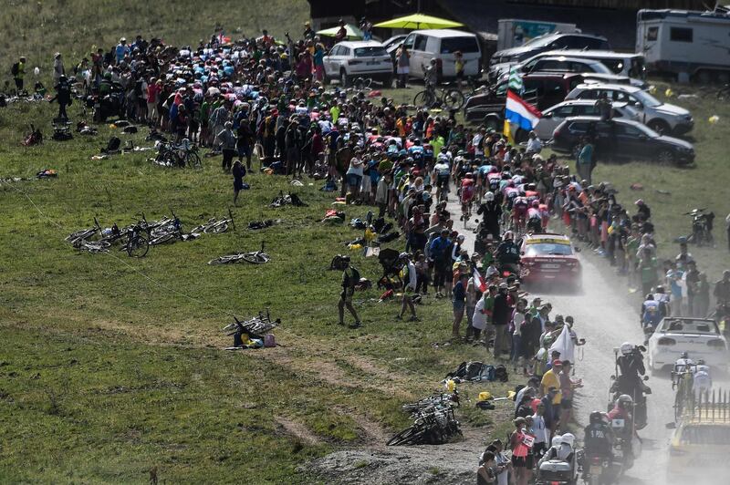 Cyclists ride in the ascent of the Plateau des Glieres during the 10th stage of the Tour de France between Annecy and Le Grand-Bornand. Jeff Pachoud / AFP