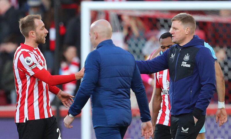 Brentford's Christian Eriksen is congratulated by Newcastle United's manager Eddie Howe after the match at Brentford Community Stadium. AFP