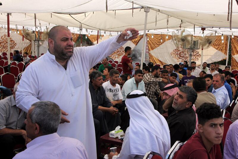 epa06106991 Zakaria al-Jawadah, (L) father of 17-year-old Muhammad al-Jawadeh, who was killed after allegedly attacking an Israeli security guard with a screwdriver, gestures at a funeral reception in Amman, Jordan, 24 July 2017. Two Jordanians were killed in a shooting at a residential building used by Israeli embassy staff in Jordan. Muhammad's family demanded the trial of their son's killer.  EPA/AHMED ABDO