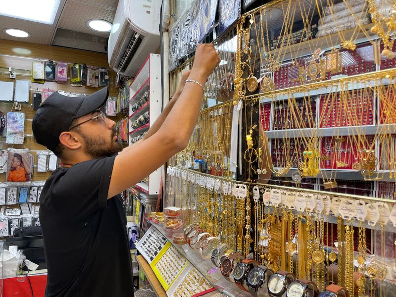 Hoping to see the tourists return this year, Ameer Bashir, 23, displays souvenirs in his shop in Karbala. Sinan Mahmoud / The National.