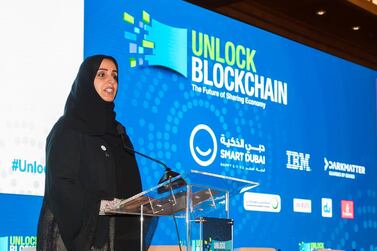 Aisha Bin Bisher, the director general, Smart Dubai Office, speaks at the Unlock Blockchain Forum. Chris Whiteoak / The National