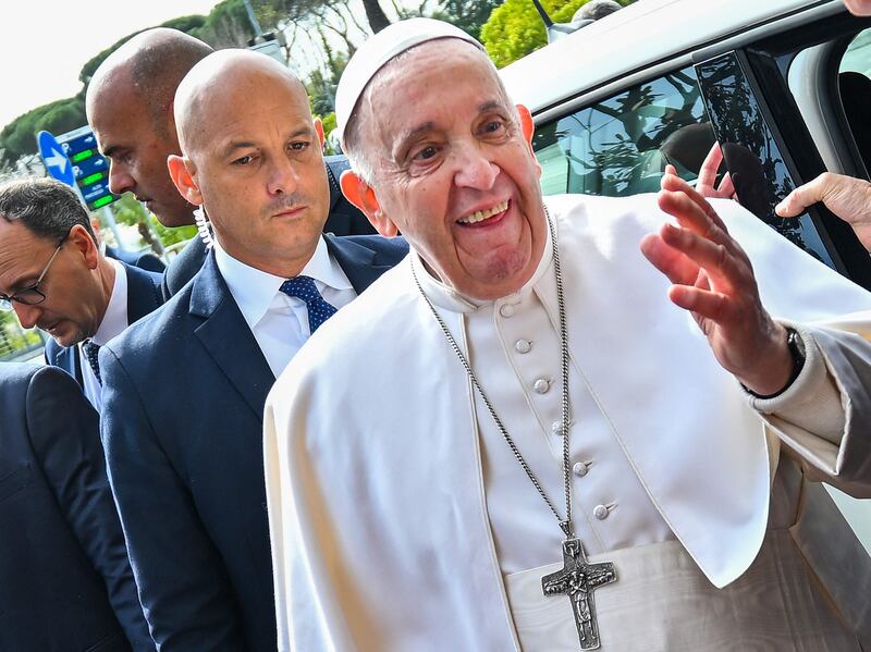 Pope Francis leaves the Gemelli Polyclinic in Rome after treatment. AFP