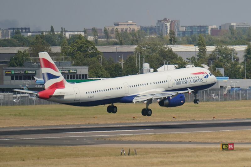 A British Airways flight comes into land at Heathrow Airport, London. PA