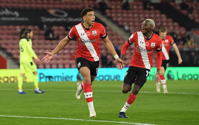 Southampton's Che Adams celebrates his opening goal with Moussa Djenepo. Getty