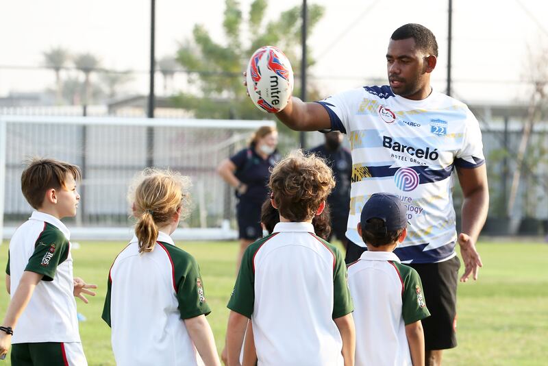 A Speranza 22 talks to players at the training session in Dubai.