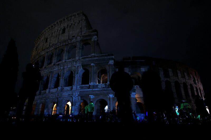 The ancient Colosseum is seen after the lights were switched off for Earth Hour in Rome, Italy. Stefano Rellandini / Reuters