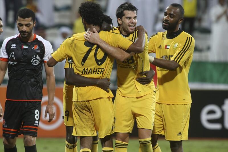 Al Wasl, in yellow, were ecstatic to beat Ajman in the President’s Cup on Monday night, but there is plenty of room for improvement. Razan Alzayani / The National