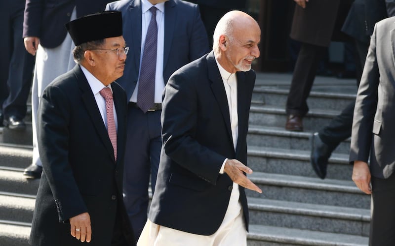 epa06569662 Afghanistan president Ashraf Ghani (R) Indonesian vice president H. Muhammad Jusuf Kalla (L) walk out after the opening ceremony of the Kabul Process Conference in the presidential palace in Kabul, Afghanistan 28 February 2018.  EPA/JAWAD JALALI