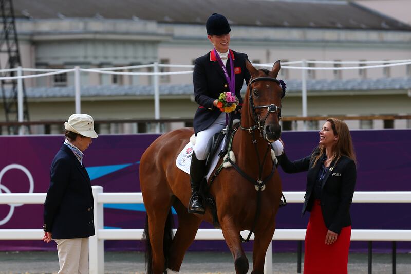 Zara Phillips riding High Kingdom speaks to her mother, Princess Anne, after receiving a silver medal at the Eventing Team Jumping event at the London 2012 Olympic Games.