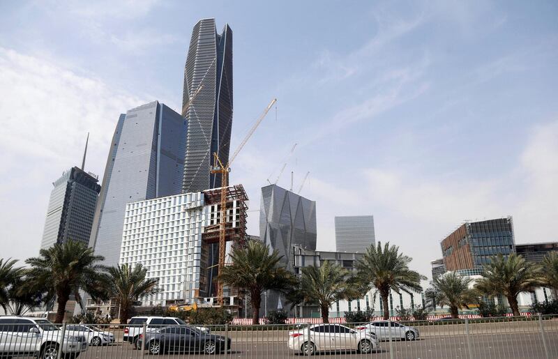 FILE PHOTO: Cars drive past the King Abdullah Financial District, north of Riyadh, Saudi Arabia, March 1, 2017. REUTERS/Faisal Al Nasser/File Photo