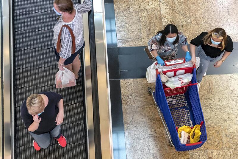 DUBAI, UNITED ARAB EMIRATES. 24 MAY 2020. The first day of the Eid holidays saw shoppers head to Mall of the Emirates to shop for both food and luxury items. Mall staff have put in place thermal scanning at entry ways and shops are supplying hand santizer and in some cases glothes when shoppers enter the stores. Social distancing is also being observed for the most part as restrictions are in place by Dubai Government. (Photo: Antonie Robertson/The National) Journalist: Kelly Clarke. Section: National.