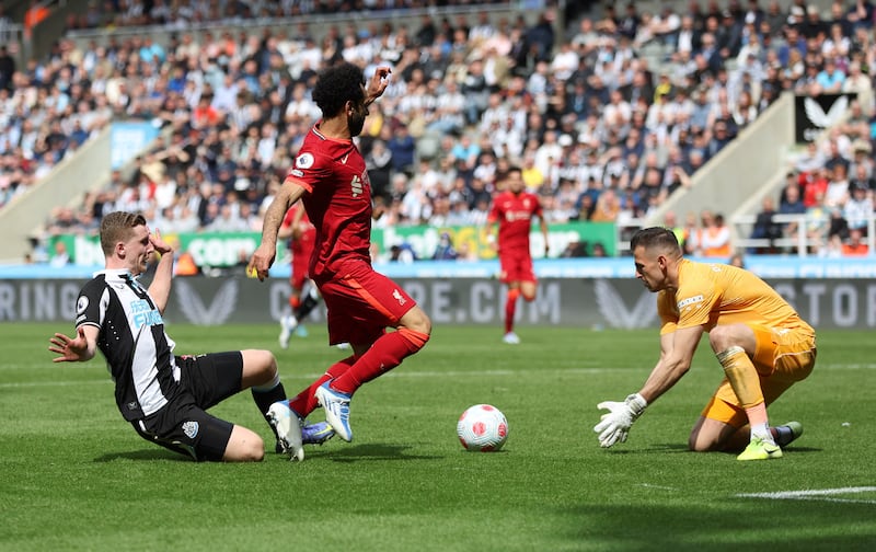 Newcastle's Martin Dubravka collects the ball from Mohamed Salah. Action Images
