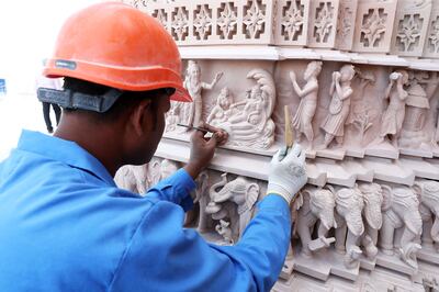 An artisan completes a carving at the Baps Hindu Temple in Abu Dhabi. Pawan Singh / The National