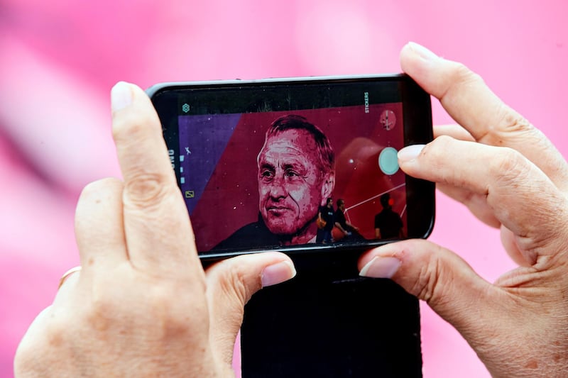 epa07798033 A Barcelona fan takes a photo with his phone during the inauguration of the Johan Cruyff Stadium. EPA