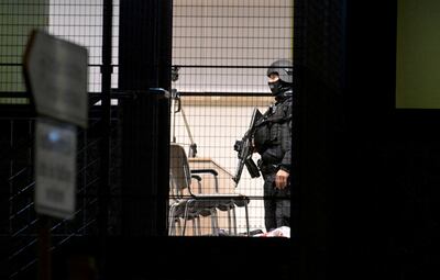 Special police stand inside the building after the shooting. Reuters 
