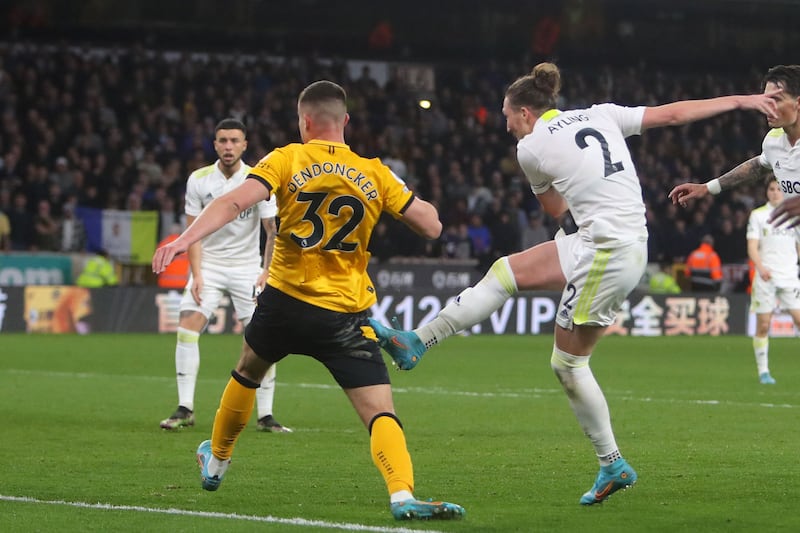 Leeds United's English defender Luke Ayling (R) unleashes the winning goal to spark pandemonium. AFP