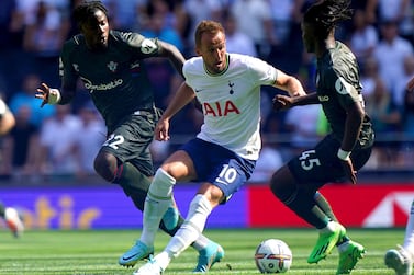 Tottenham Hotspur's Harry Kane, centre, battles for the ball with Southampton's Mohammed Salisu, left and Romeo Lavia, during the English Premier League soccer match betten Tottenham Hotspur and Southampton at Tottenham Hotspur Stadium, London, Saturday Aug.  6, 2022.  (Kirsty O'Connor / PA via AP)