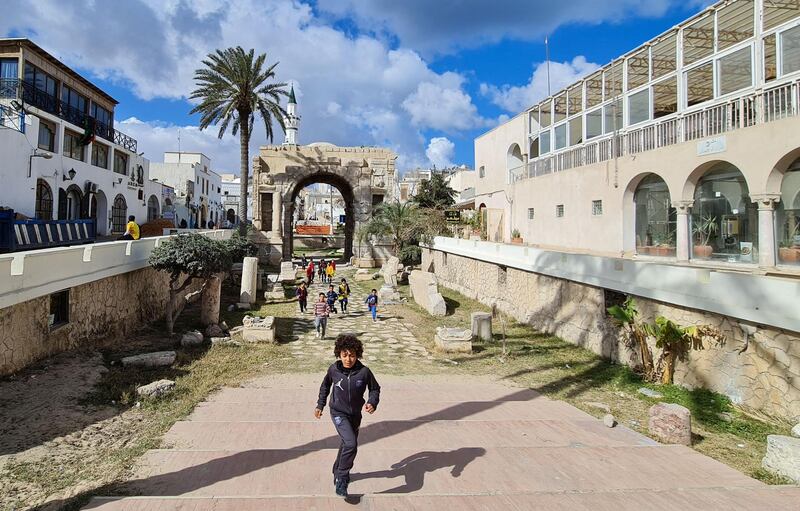 Children play near the Roman Marcus Aurelius arch in Tripoli's old city, Libya. AFP