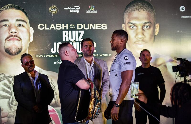 Andy Ruiz Jr and Anthony Joshua square off during the "Clash on the Dunes" press conference. AFP