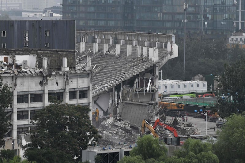 Workers demolish the Workers' Stadium in Beijing. AFP