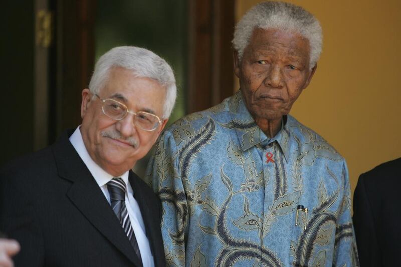 Palestine Authority chief Mahmoud Abbas with Mandela. Kim Ludbrook / 