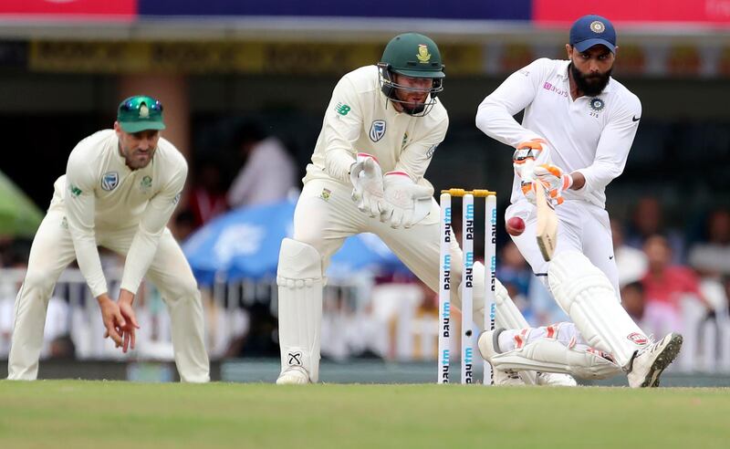 India's Ravindra Jadeja, right, plays a shot. AP