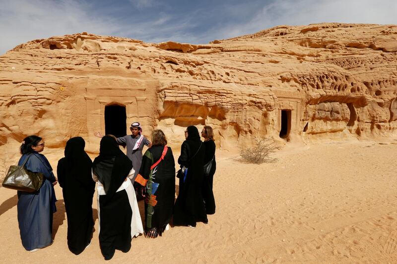 Visitors tour the majestic rock-hewn tombs of Madain Saleh near the city Al Ula in Saudi Arabia. Reuters