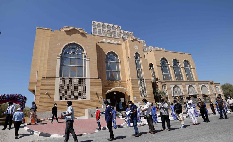 Members of Dubai's Indian community queue for their Sinopharm inoculation at the Guru Nanak Darbar gurudwara's second vaccine drive in Dubai. Karim Sahib / AFP