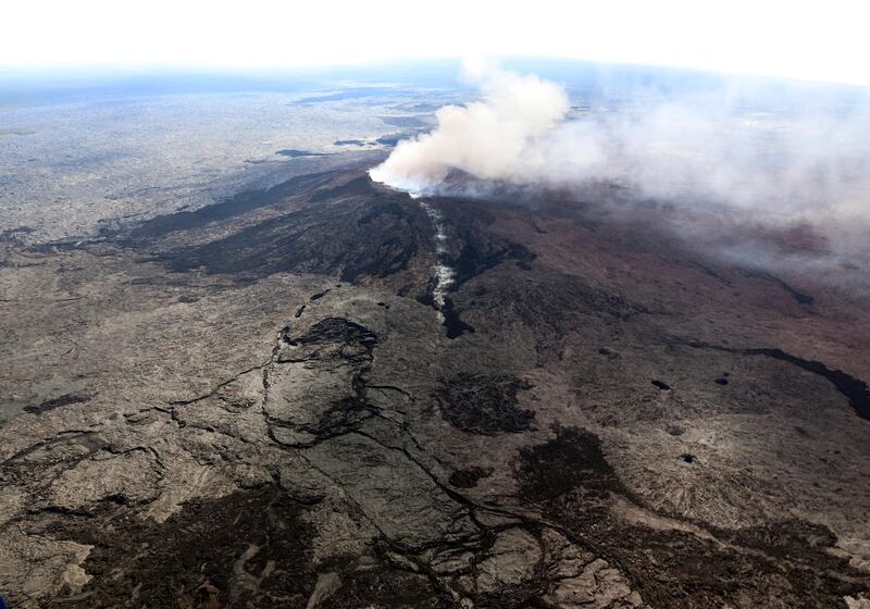 An ash plume rises above the Puu Oo crater, on Hawaii's Kilaueaa Volcano in Hawaii Volcanoes National Park. AP Photo
