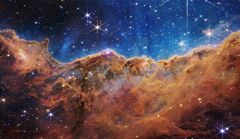 The 'Cosmic Cliffs' of the Carina Nebula. Photo: JWST
