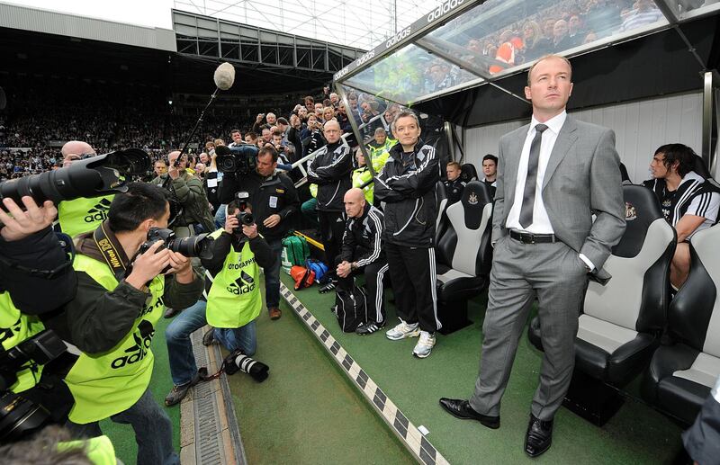 Numerous photographers point their camera at Alan Shearer as he takes his place in the Newcastle United dugout. PA