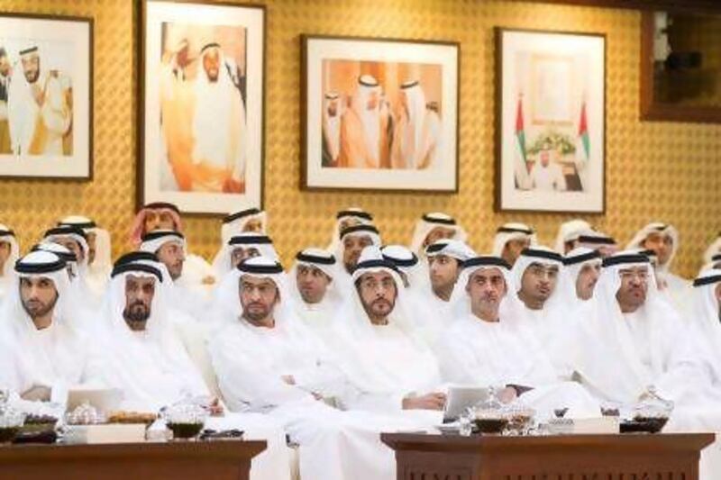 Sheikh Hamdan bin Zayed, the Deputy Prime Minister (third left), and Sheikh Saif bin Zayed, the Interior Minister (fifth left), with other attendees at the lecture.