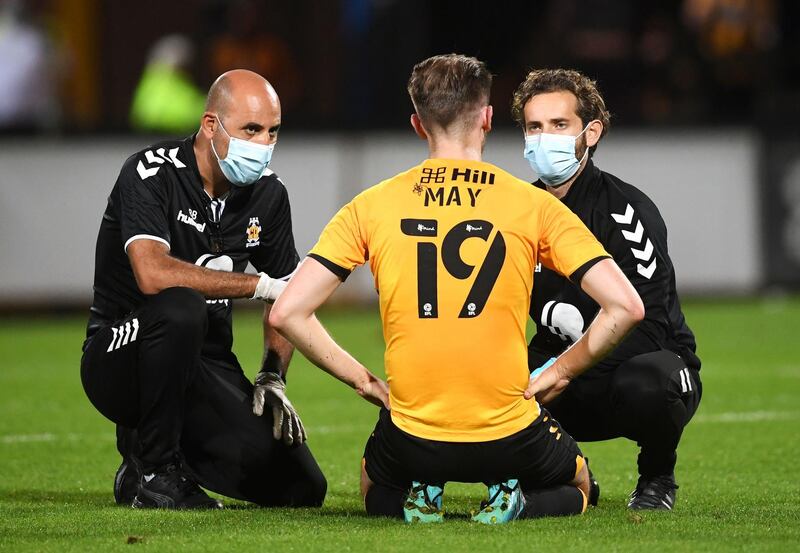 Cambridge United's Adam May receives treatment for an injury during the EFL Trophy Southern Group H match at the Abbey Stadium, Cambridge. PA Photo