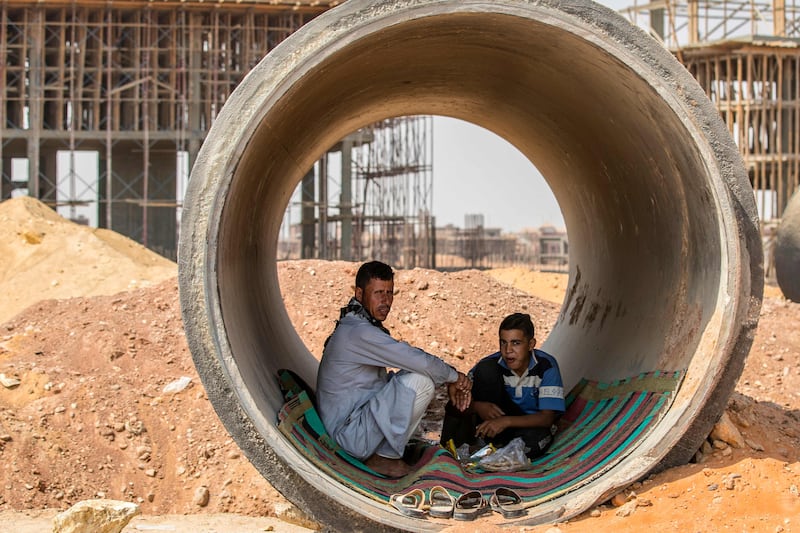 Labourers take a break at a construction site at Egypt's 'New Administrative Capital' megaproject, some 45 kilometres east of Cairo.