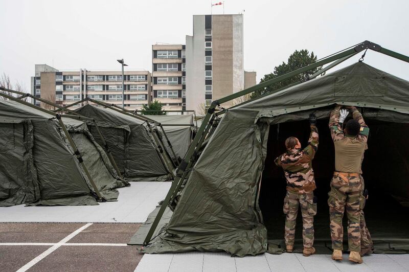 French soldiers of La Valbonne medical regiment set up a military field hospital at the Emile Muller Hospital in Mulhouse, eastern France.  AFP