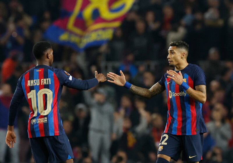 Barcelona's Raphinha celebrates scoring their second goal with Ansu Fati. Reuters
