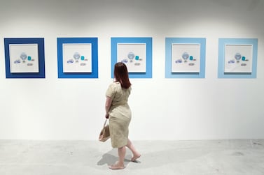 A spectator at the Gateway: Fragments, Yesterday and Today exhibition during the 11th edition of Abu Dhabi Art. The exhibition is still available to see at Manarat Al Saadiyat, Saadiyat Cultural District. Reem Mohammed / The National