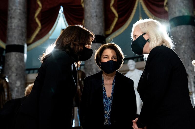 Democratic Vice Presidential Candidate Kamala Harris talks with Senator Amy Klobuchar and Senator Kirsten Gillibrand before the start of a ceremony to honour the late Associate Justice Ruth Bader Ginsburg in the Statuary Hall of the US Capitol, Washington, DC, US. Reuters