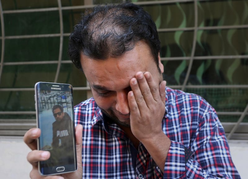 A relative weeps while showing the picture of Sohail Shahid, a Pakistani citizen who was killed in Christchurch mosque shootings. AP Photo
