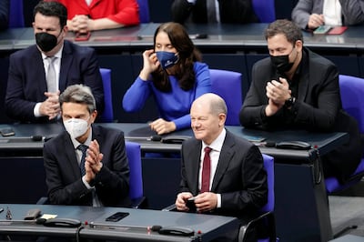 Olaf Scholz took off his mask to confirm that he would accept his appointment as chancellor. AP
