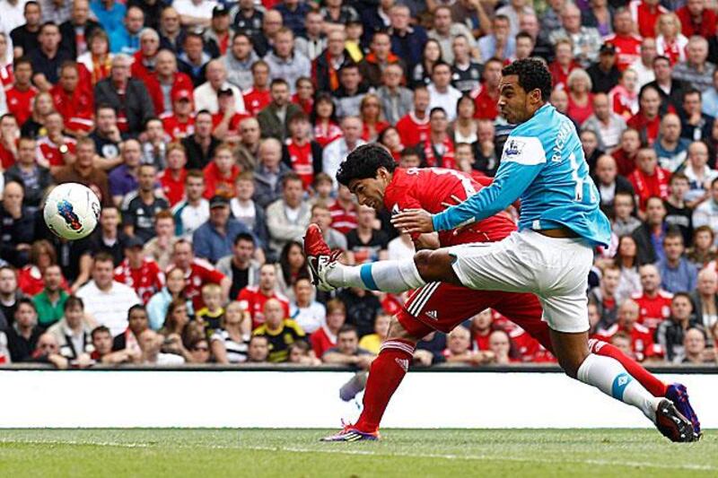 Luis Suarez made up for his early penalty miss to head Liverpool into the lead.

Jon Super / AP Photo