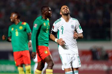 Algerias' Riyad Mahrez reacts during the World Cup 2022 qualifying soccer match at the Mustapha Tchaker stadium in Blida, Algeria, Tuesday, March 29, 2022.  Cameroon won 2-1 and join Ghana, Senegal, Morocco and Tunisia in representing Africa at the 2022 FIFA World Cup.  (AP Photo / Anis Belghoul)